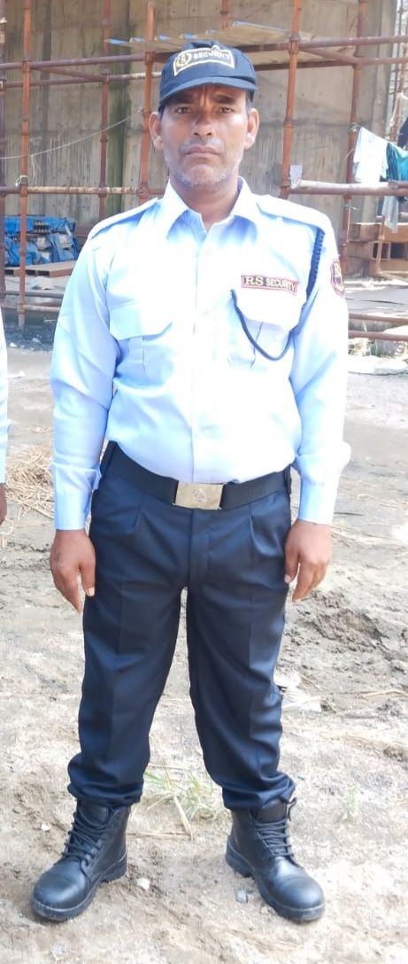 RS Enterprises security staff in light-blue uniform at a building site